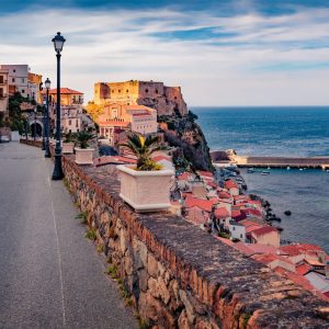 Empty,Road,Of,Scilla,Town,With,Ruffo,Castle,On,Background.