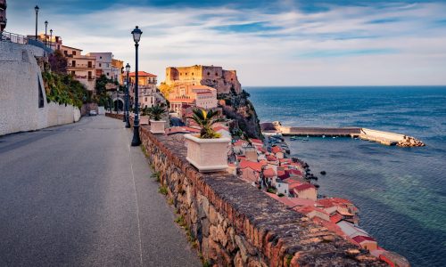 Empty,Road,Of,Scilla,Town,With,Ruffo,Castle,On,Background.